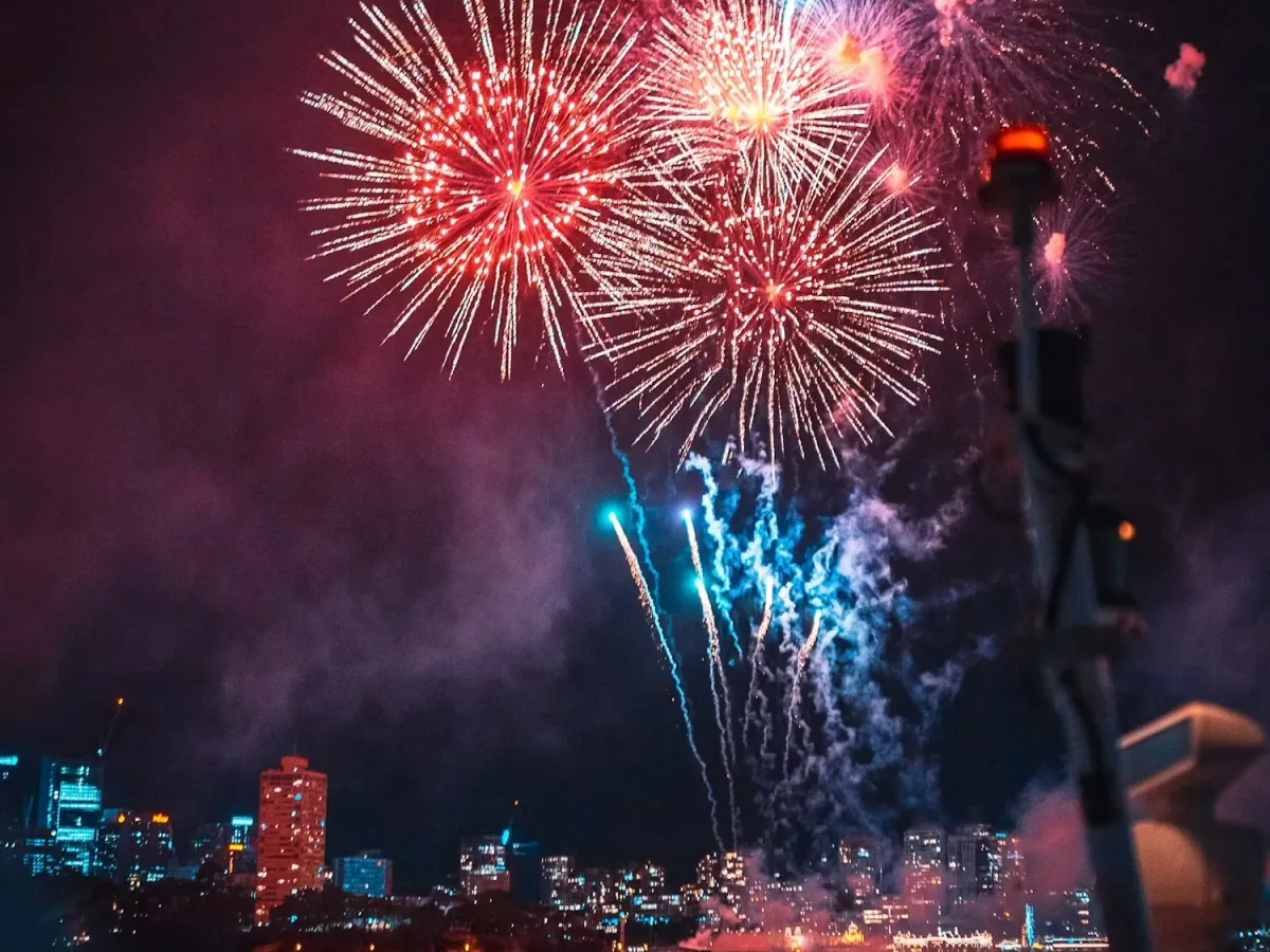 Fireworks over a city skyline on New Year's Eve